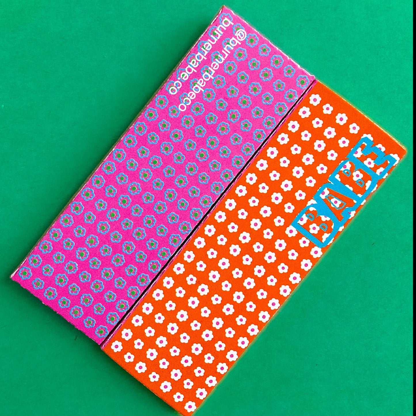 The Flaunt Rolling Papers, set of 10: bright green leaf, frond patterned rolling papers. These designer rolling papers are girly, pretty, vegan, cute, cool, standard size, high quality, even burn, natural dyes, best tasting, slow burn.