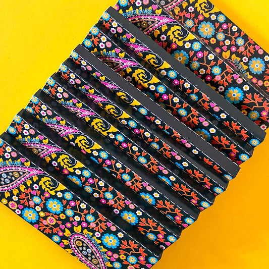 The Starlit Papers, set of 10: star, moon, galaxy patterned rolling papers. These designer rolling papers are girly, pretty, vegan, cute, cool, standard size, high quality, even burn, natural dyes, best tasting, slow burn.