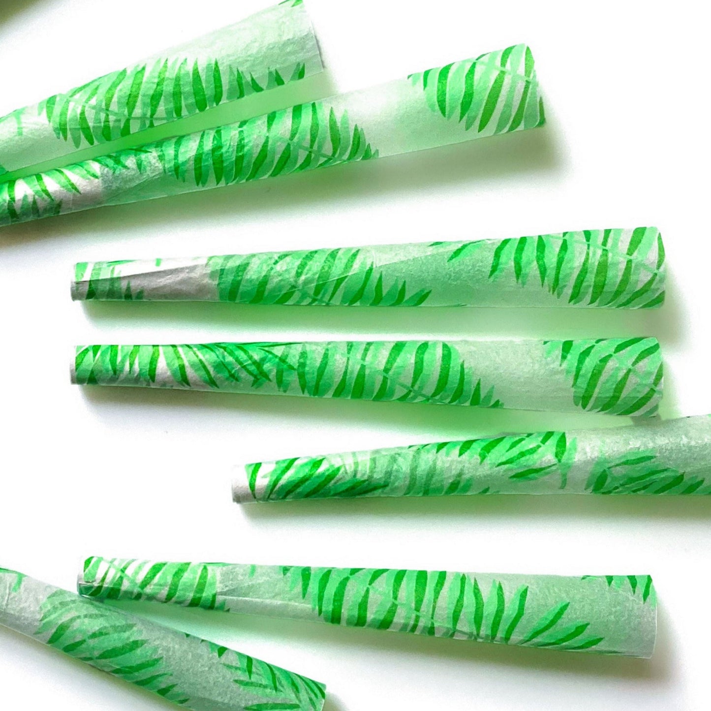 The Flaunt Cones, set of 8: leaf, frond patterned pre-rolled cones. These designer pre-rolled cones are girly, pretty, vegan, cute, cool, standard size, high quality, even burn, natural dyes, best tasting, slow burn.