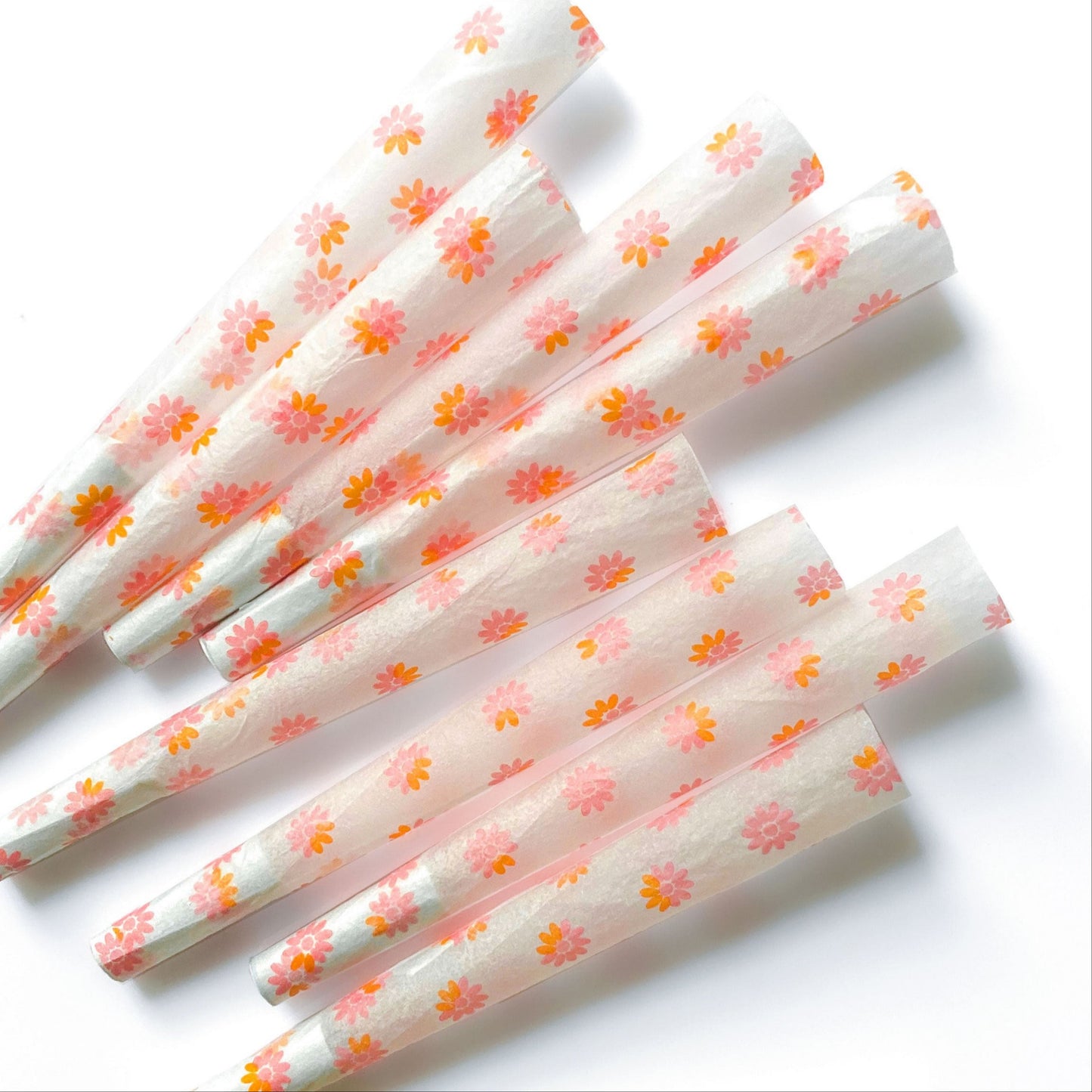 The Fleurt Cones, set of 8: pink and orange floral pre-rolled cones. These designer cones are girly, pretty, vegan, cute, cool, standard size, high quality, even burn, natural dyes, best tasting, slow burn.
