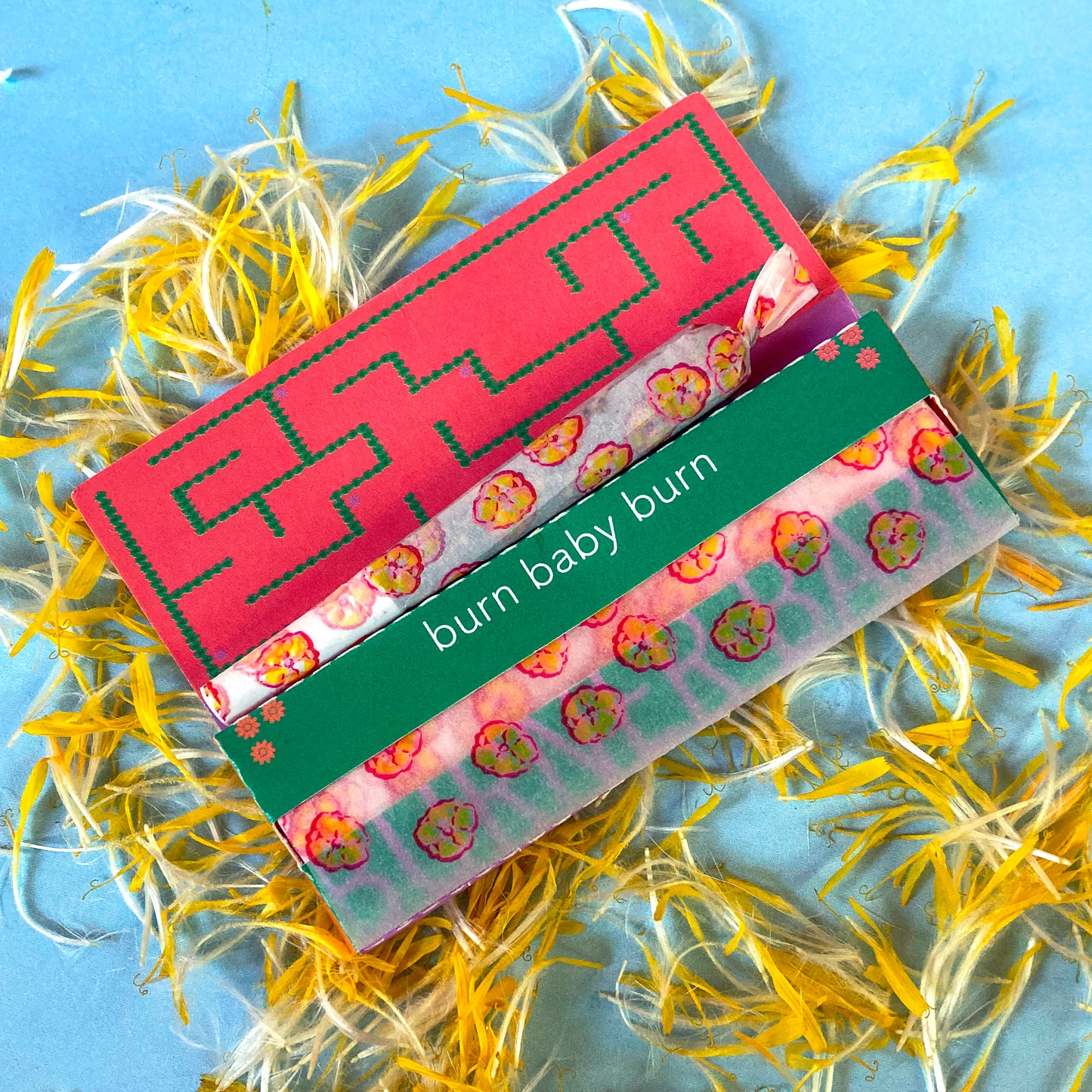 The Poppy Papers: yellow poppy printed papers. These designer rolling papers are girly, pretty, vegan, cute, cool, standard size, high quality, even burn, natural dyes, best tasting, slow burn.