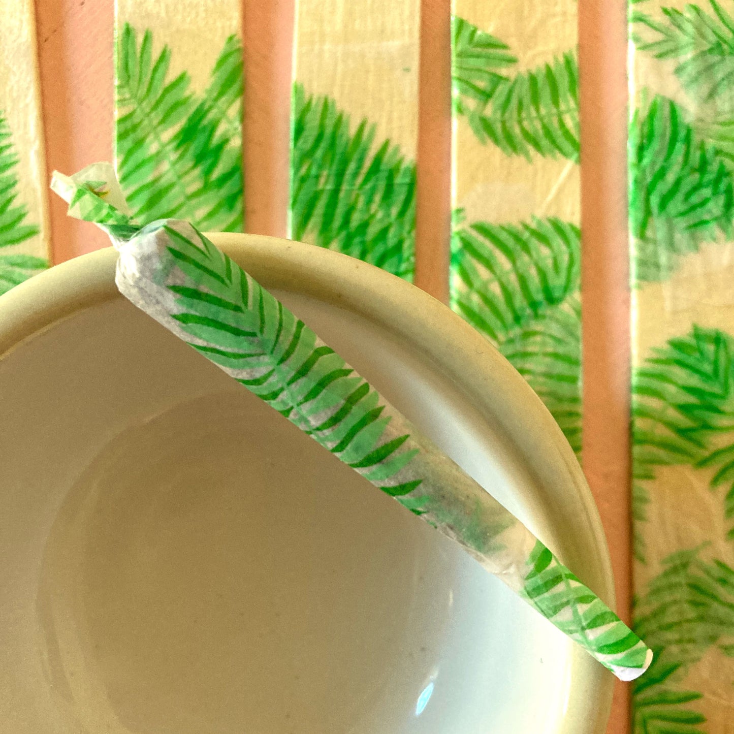 The Flaunt Rolling Papers, set of 10: bright green leaf, frond patterned rolling papers. These designer rolling papers are girly, pretty, vegan, cute, cool, standard size, high quality, even burn, natural dyes, best tasting, slow burn.
