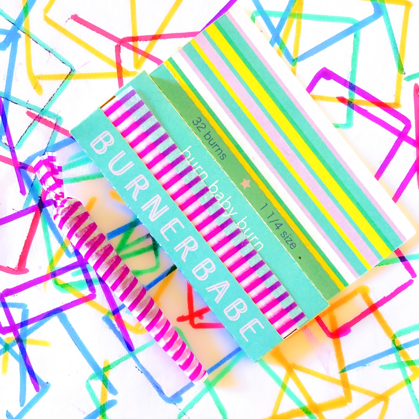 The Poseur Papers, set of 10: magenta striped rolling papers. These designer rolling papers are girly, pretty, vegan, cute, cool, standard size, high quality, even burn, natural dyes, best tasting, slow burn.