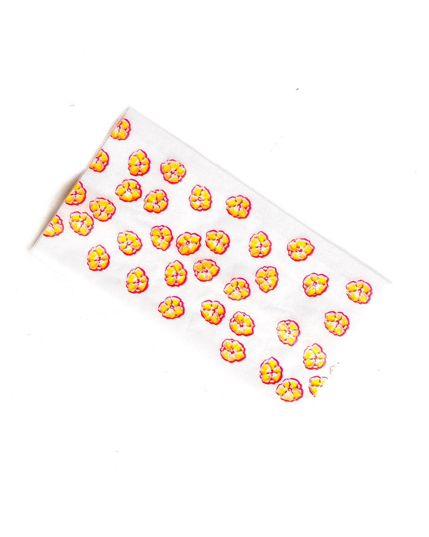 The Poppy Papers, set of 10: yellow poppy printed papers. These designer rolling papers are girly, pretty, vegan, cute, cool, standard size, high quality, even burn, natural dyes, best tasting, slow burn.