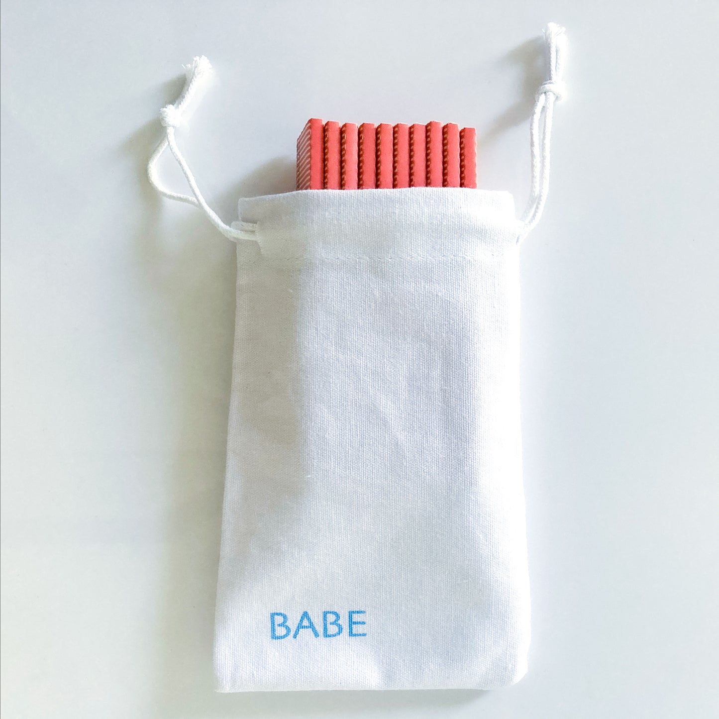The Big Fleurt Papers, set of 10 in a white cotton pouch: Major Babe size pink and orange floral rolling papers. These designer papers are girly, pretty, vegan, cute, cool, king size, high quality, even burn, natural dyes, best tasting, slow burn.