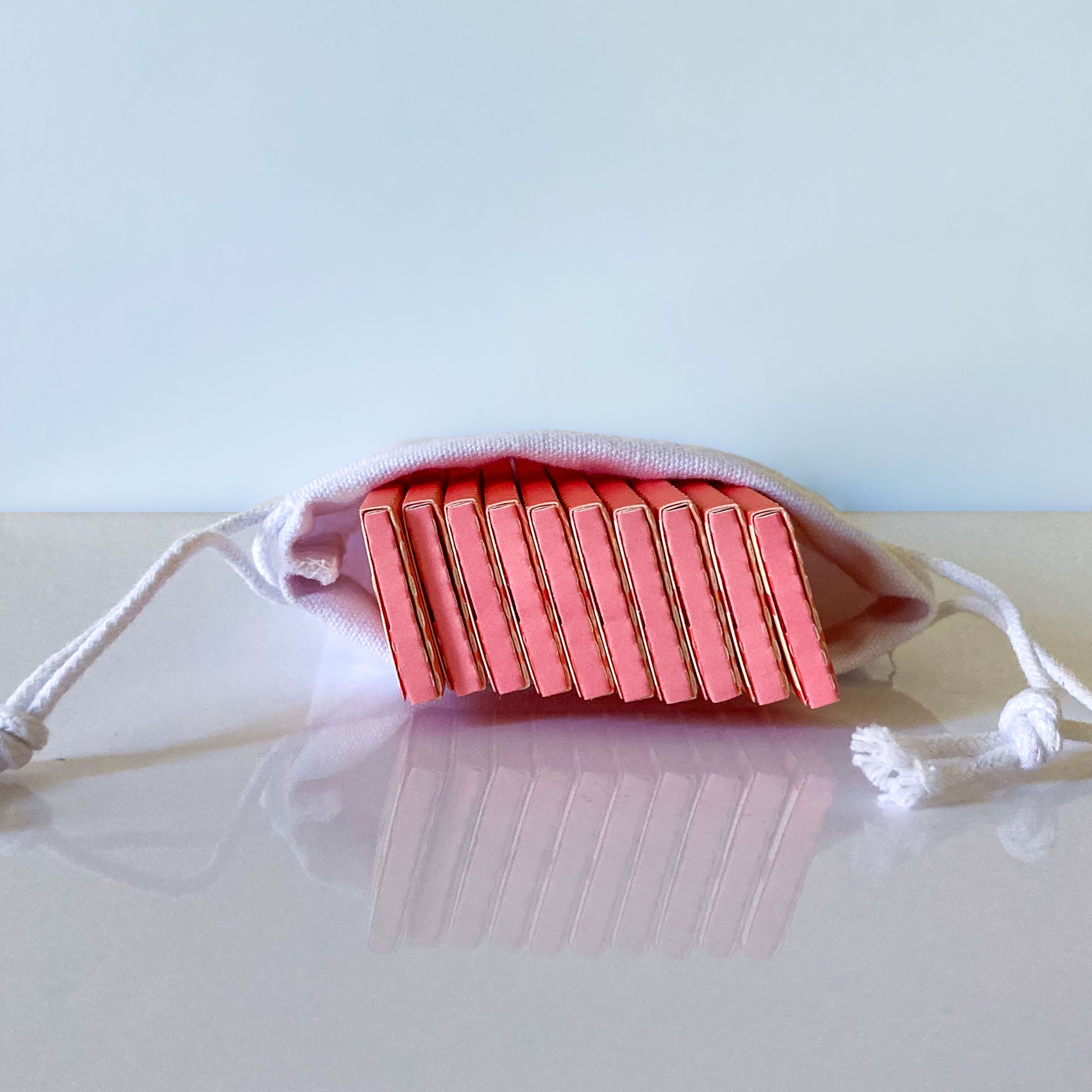 The Big Fleurt Papers, set of 10 in a white cotton drawstring pouch: Major Babe size pink and orange floral rolling papers. These designer papers are girly, pretty, vegan, cute, cool, king size, high quality, even burn, natural dyes, best tasting, slow burn.