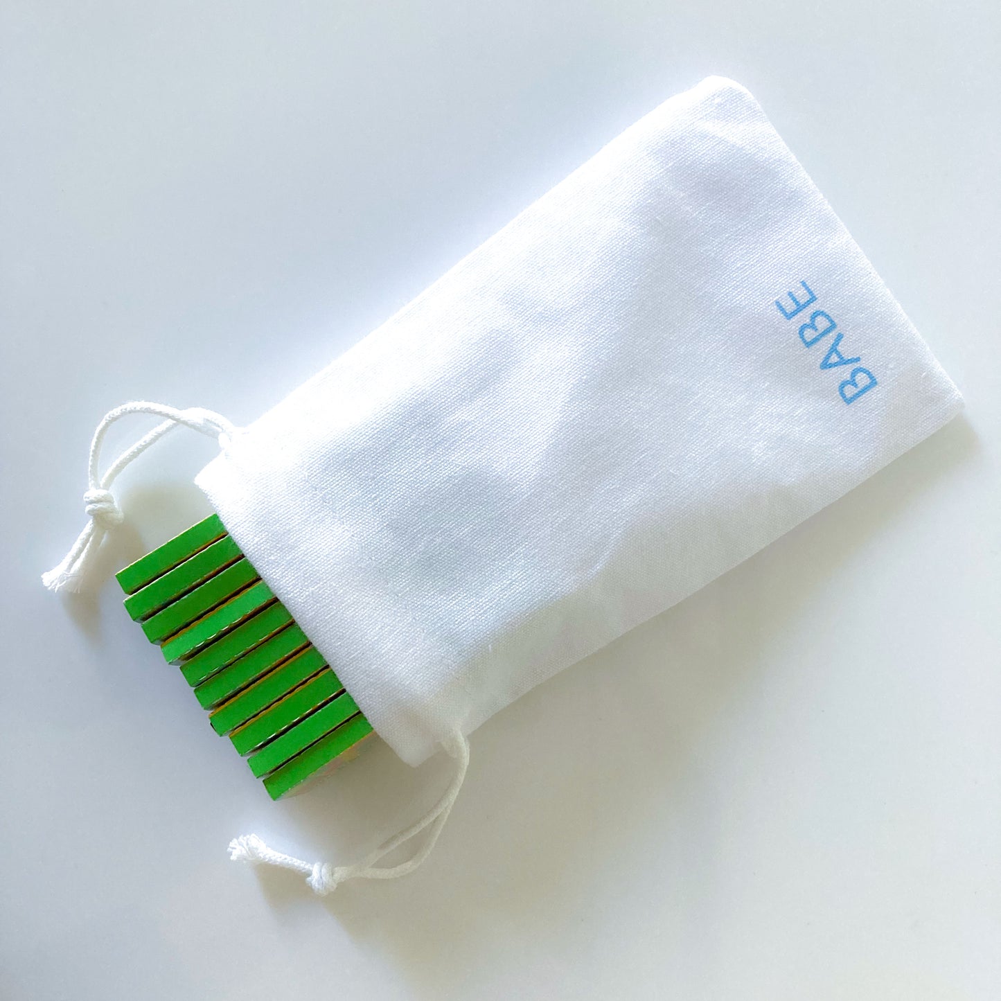 The Chick Lick Papers, set of 10 in a white drawstring cotton pouch: popsicle patterned rolling papers. These designer rolling papers are girly, pretty, vegan, cute, cool, standard size, high quality, even burn, natural dyes, best tasting, slow burn.