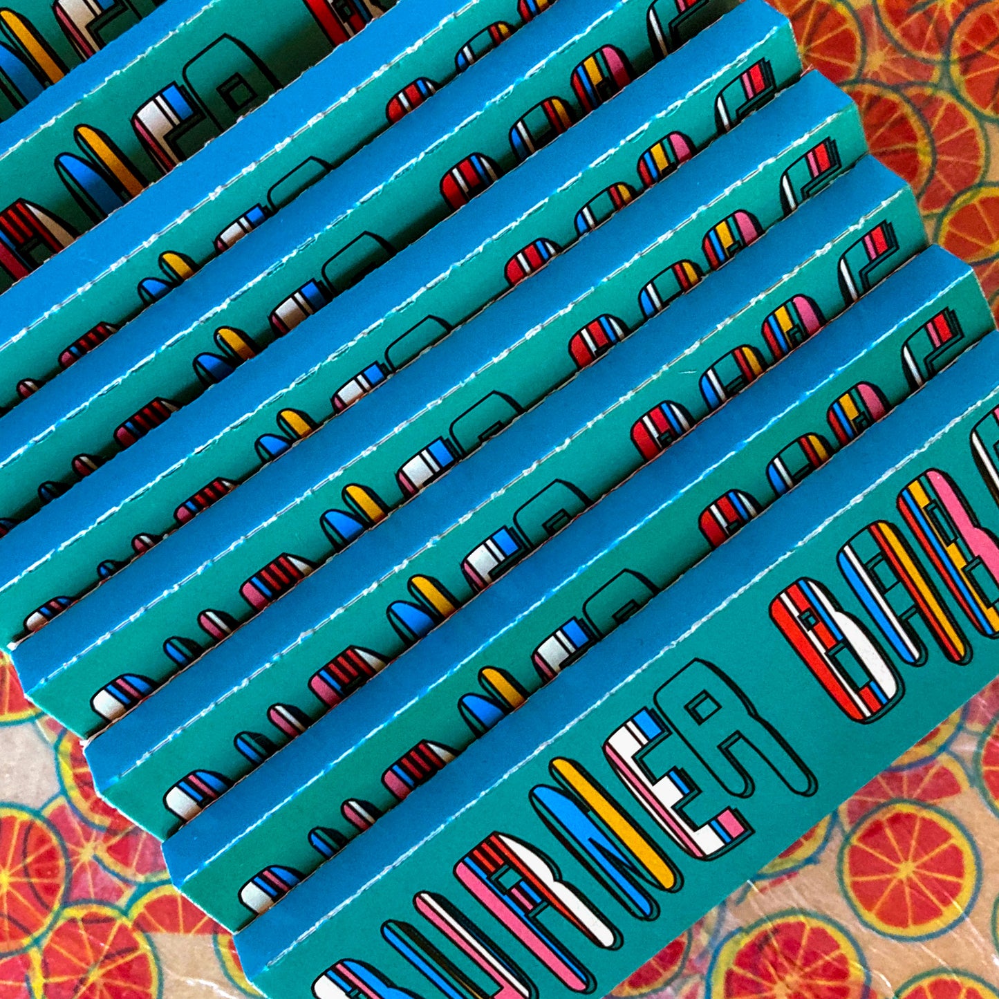 The Citrus Papers, set of 10: Grapefruit fruit printed rolling papers. These designer rolling papers are girly, pretty, vegan, cute, cool, standard size, high quality, even burn, natural dyes, best tasting, slow burn.