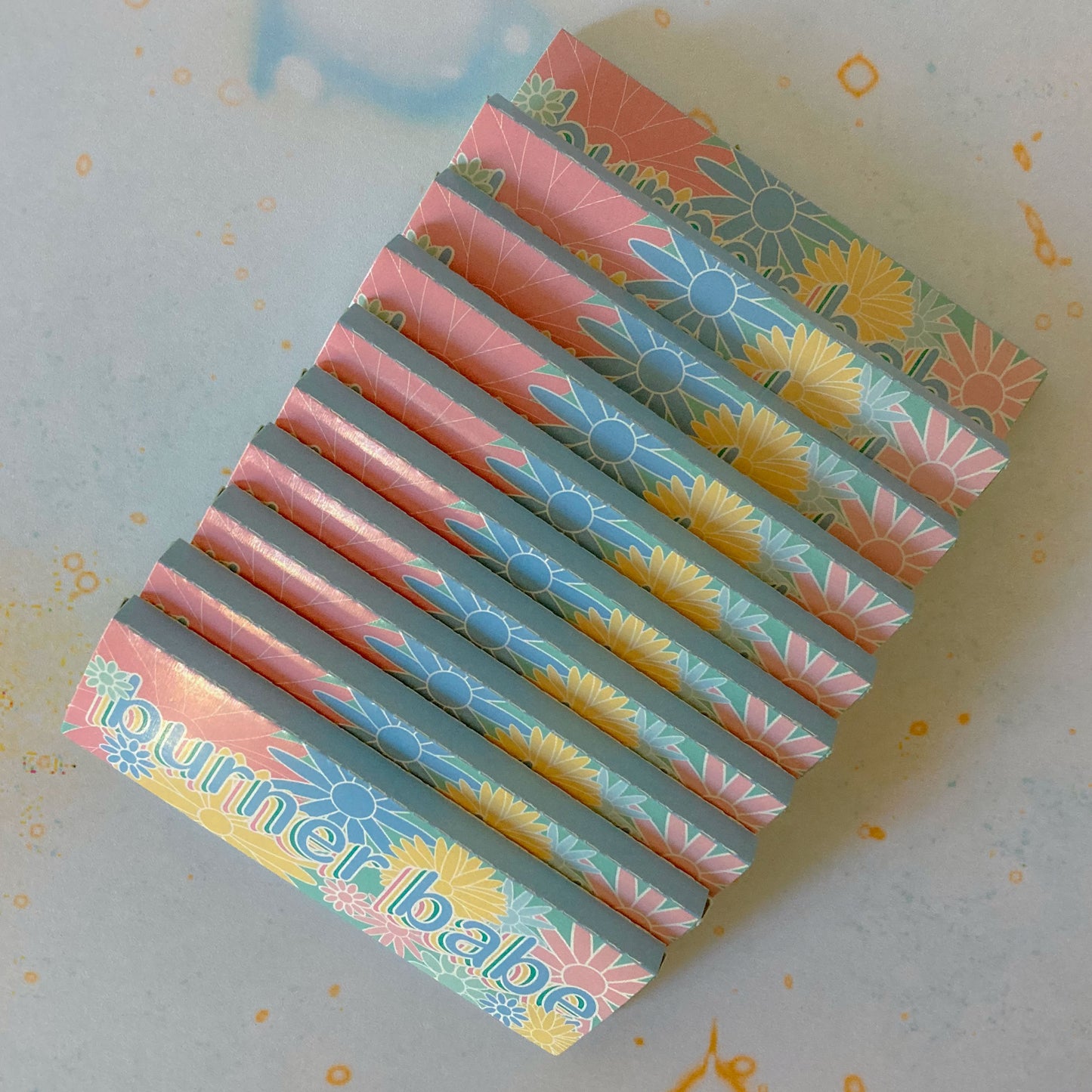 The Heartbreaker Papers, set of 10: spiral printed rolling papers. These designer rolling papers are girly, pretty, vegan, cute, cool, standard size, high quality, even burn, natural dyes, best tasting, slow burn.