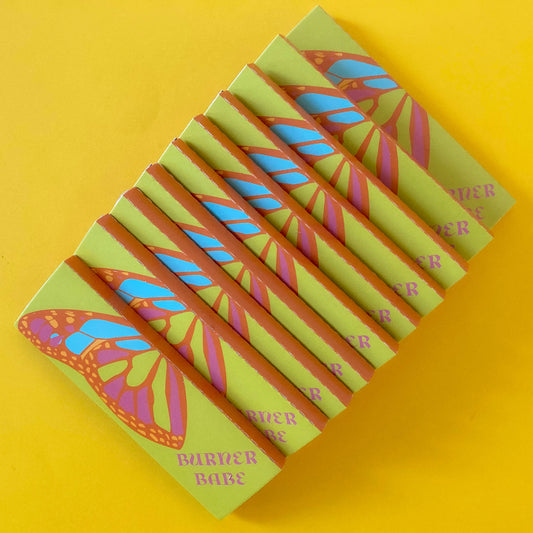 The Lucky Papers, set of 10: purple and orange floral papers. These designer rolling papers are girly, pretty, vegan, cute, cool, standard size, high quality, even burn, natural dyes, best tasting, slow burn.