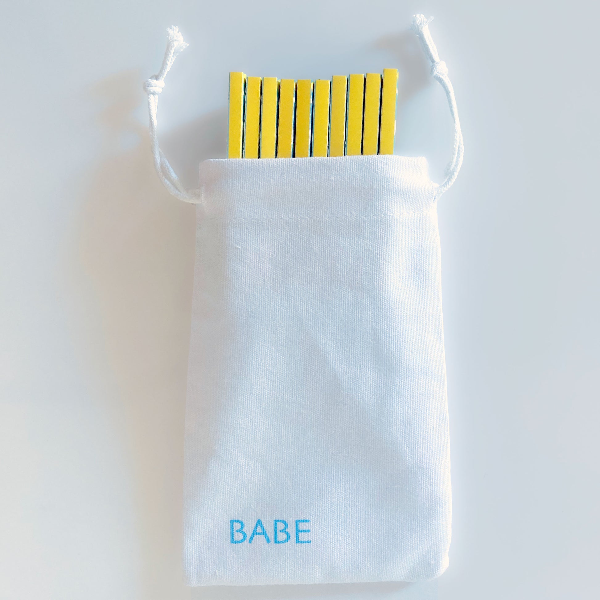 The (Ob)session Papers, set of 10, in a white cotton drawstring pouch: heart adorned rolling papers. These designer rolling papers are girly, pretty, vegan, cute, cool, standard size, high quality, even burn, natural dyes, best tasting, slow burn.