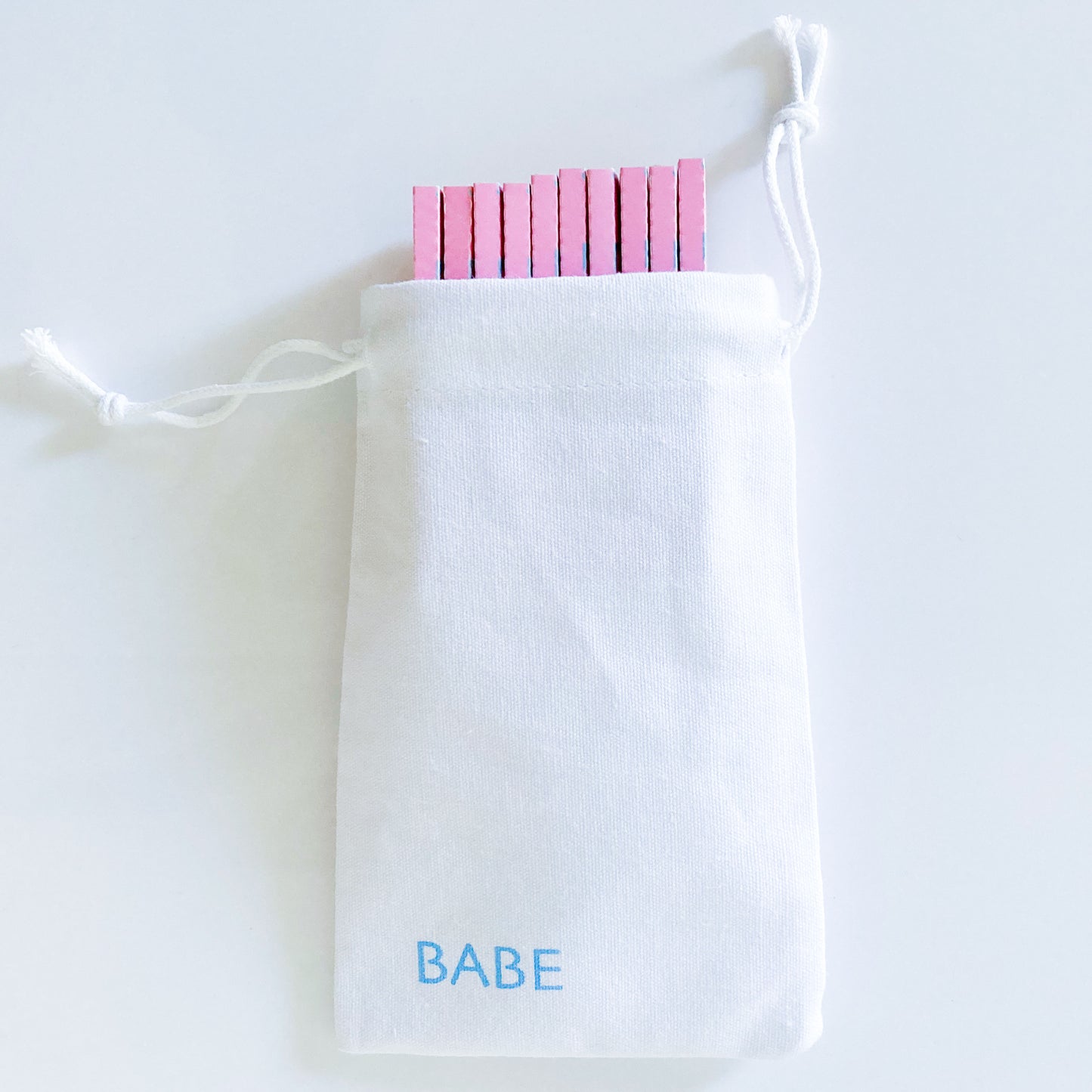 pollyanna papers, set of 10 in a white cotton pouch : blue flower papers. These designer rolling papers are girly, pretty, vegan, cute, cool, standard size, high quality, even burn, natural dyes, best tasting, slow burn.