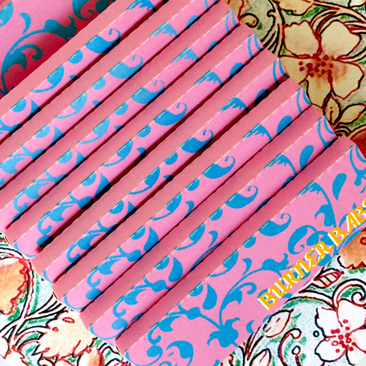 pollyanna papers, set of 10 : blue flower papers. These designer rolling papers are girly, pretty, vegan, cute, cool, standard size, high quality, even burn, natural dyes, best tasting, slow burn.