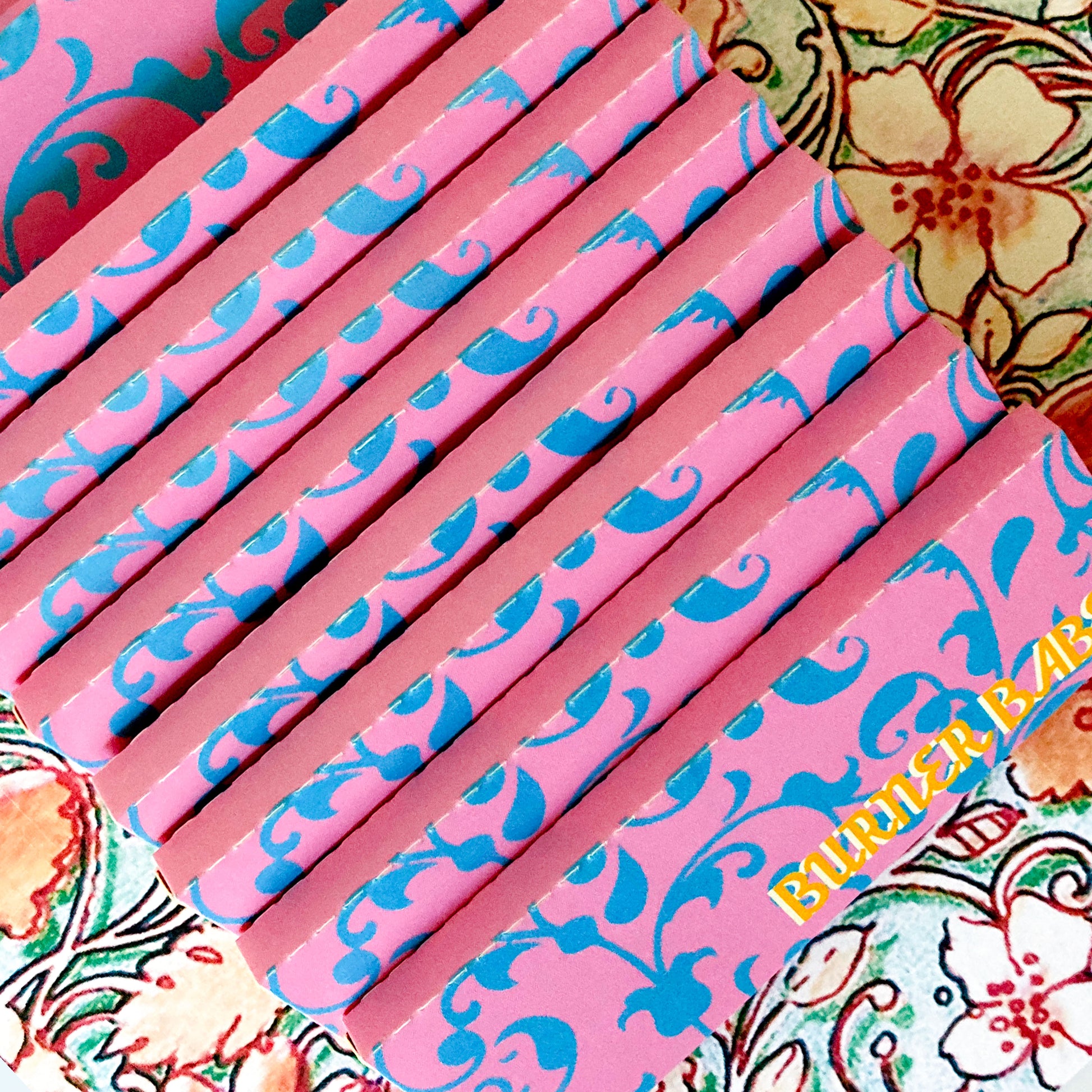 pollyanna papers, set of 10 : blue flower papers. These designer rolling papers are girly, pretty, vegan, cute, cool, standard size, high quality, even burn, natural dyes, best tasting, slow burn.