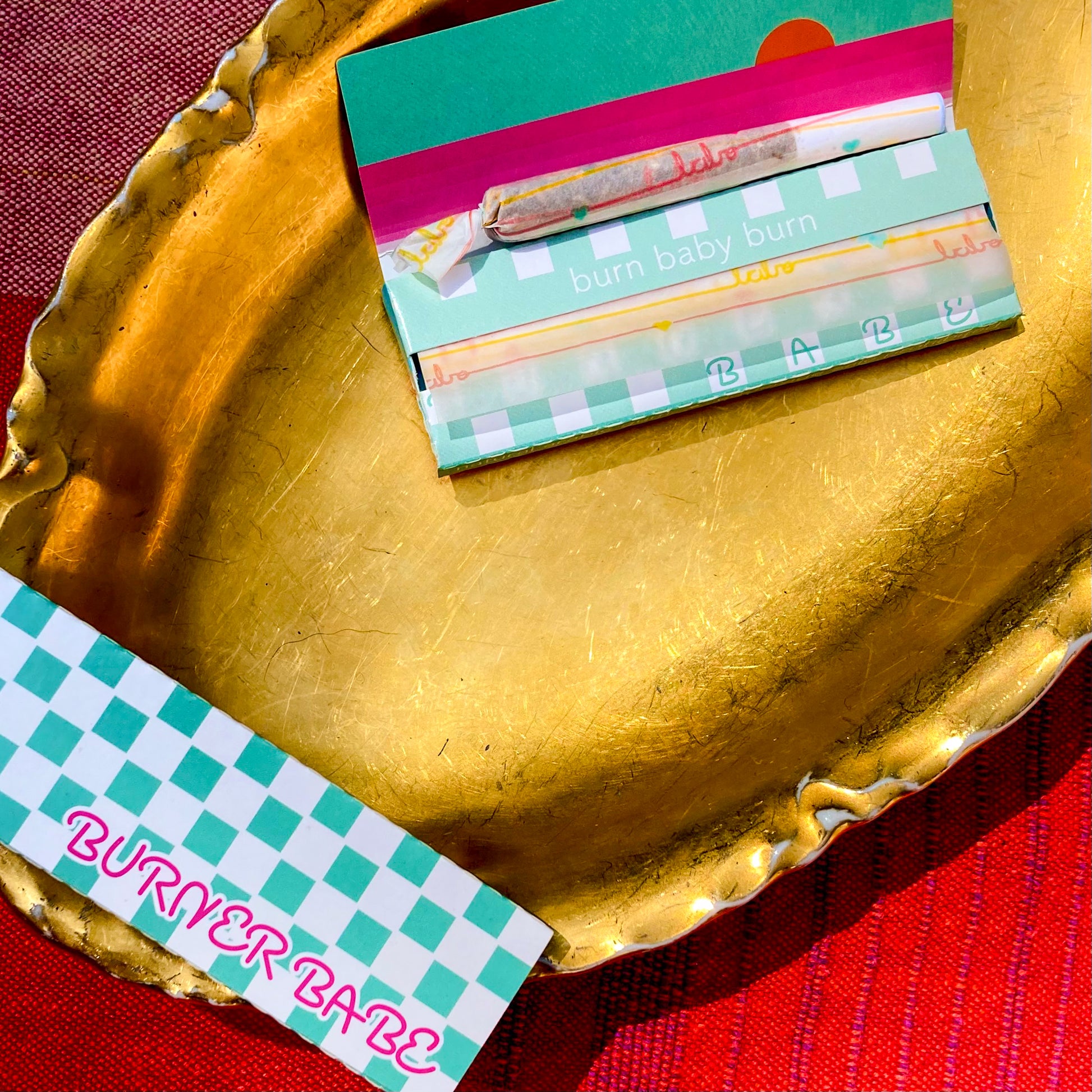 The Postscript Papers: "babe" and heart adorned rolling papers. These designer rolling papers are girly, pretty, vegan, cute, cool, standard size, high quality, even burn, natural dyes, best tasting, slow burn.