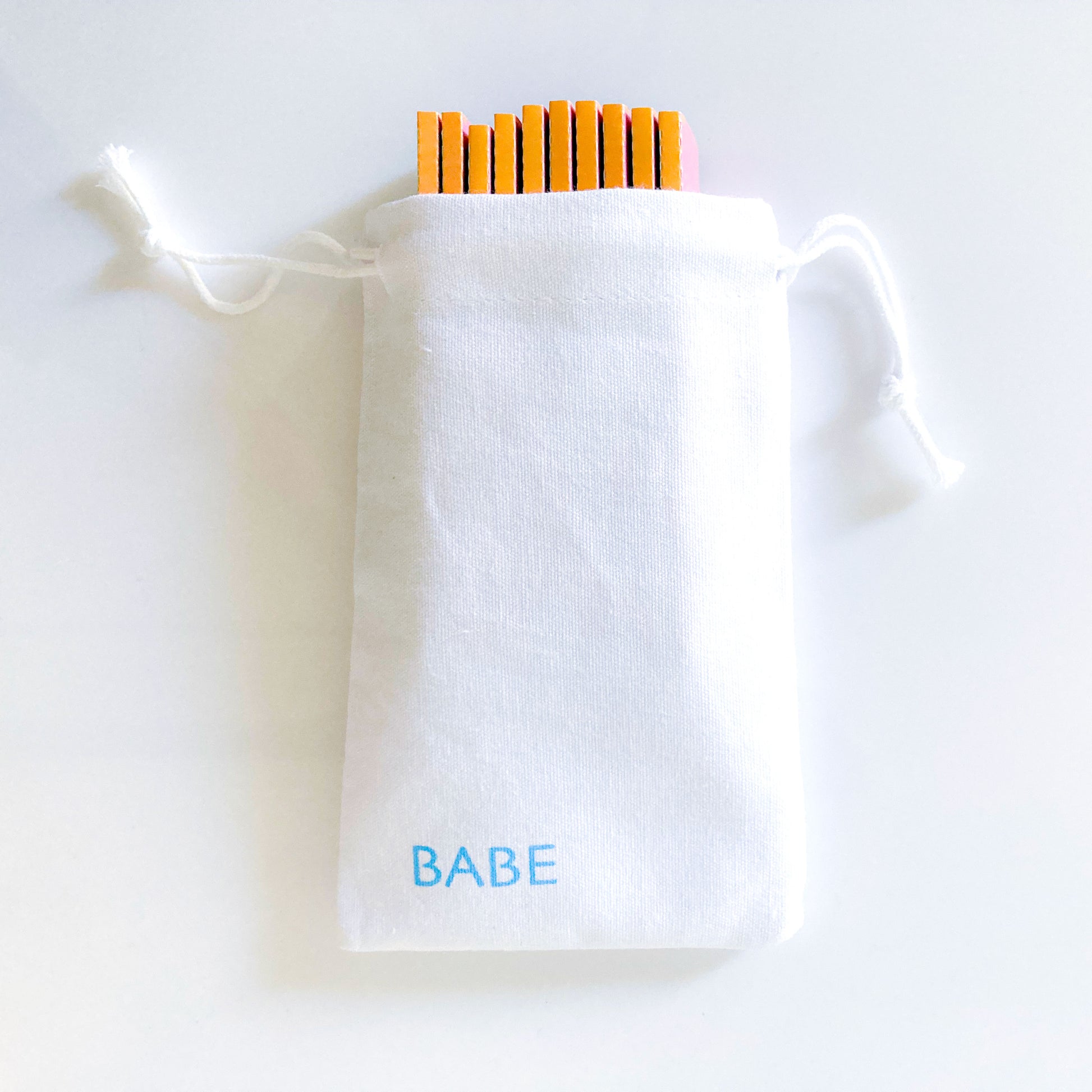 The Sweetheart Papers, set of 10 in a white cotton drawstring pouch: Major Babe size heart printed rolling papers. These designer papers are girly, pretty, vegan, cute, cool, king size, high quality, even burn, natural dyes, best tasting, slow burn.
