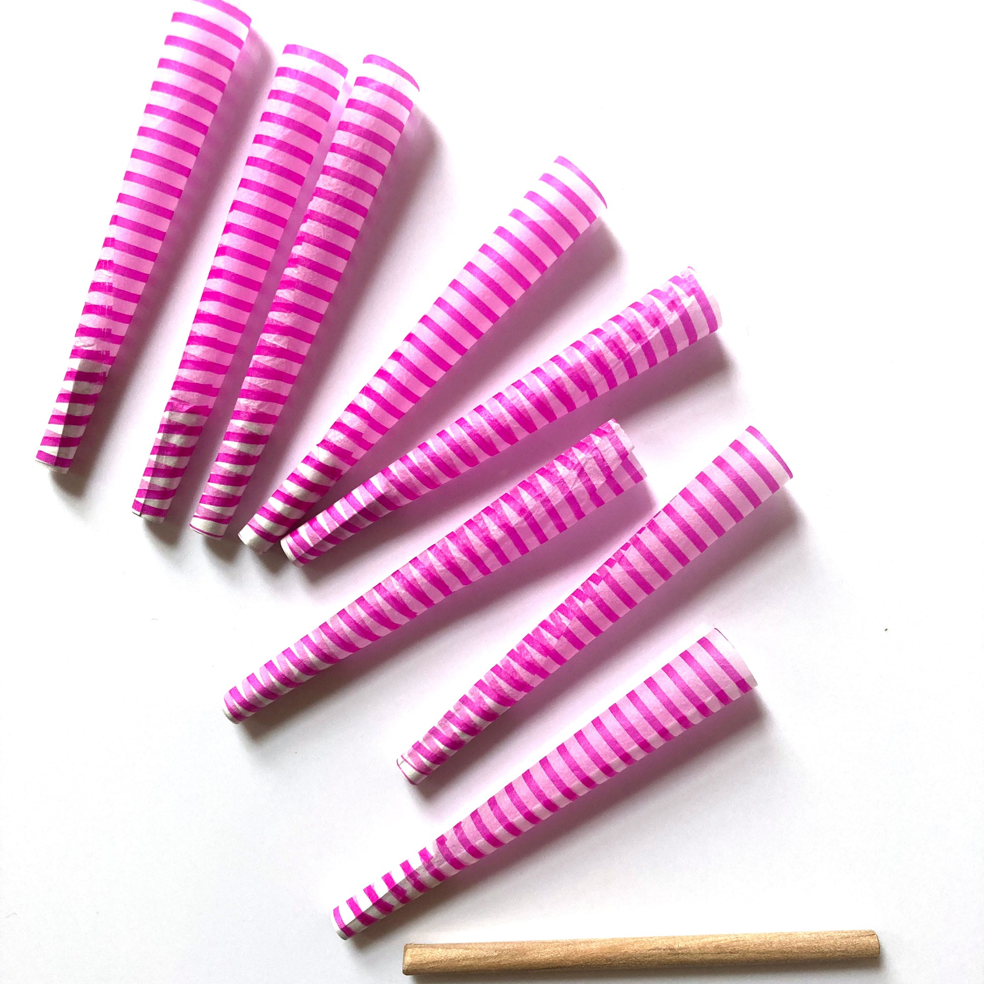 The Poseur Cones, set of 8: magenta striped pre-rolled cones. These designer pre-rolled cones are girly, pretty, vegan, cute, cool, standard size, high quality, even burn, natural dyes, best tasting, slow burn.