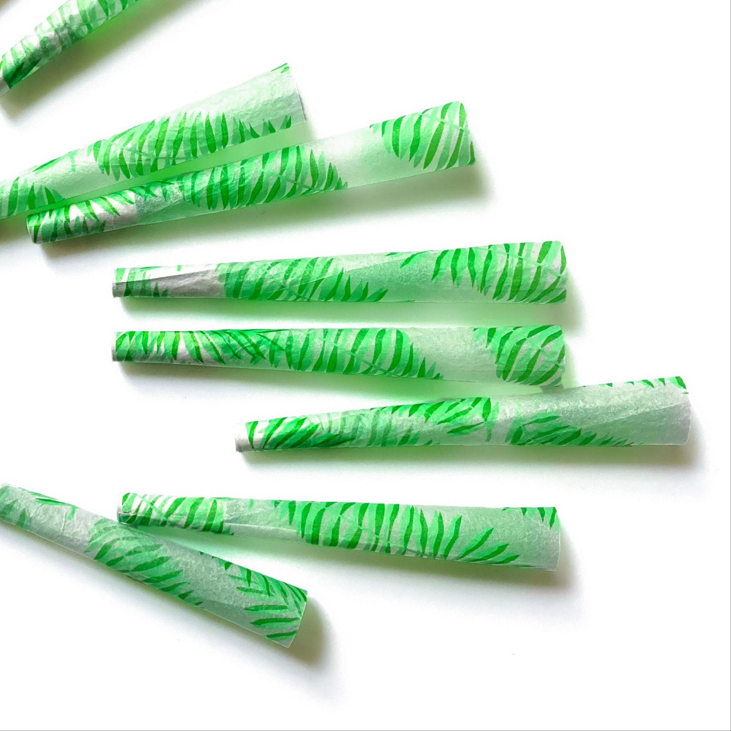 The Flaunt Cones, set of 8: leaf, frond patterned pre-rolled cones. These designer pre-rolled cones are girly, pretty, vegan, cute, cool, standard size, high quality, even burn, natural dyes, best tasting, slow burn.