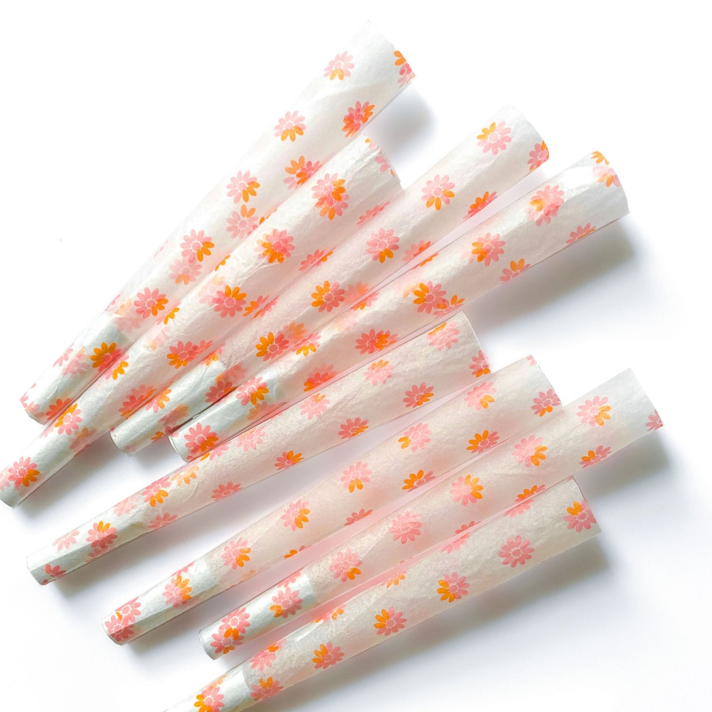 The Fleurt Cones, set of 8: pink and orange floral pre-rolled cones. These designer cones are girly, pretty, vegan, cute, cool, standard size, high quality, even burn, natural dyes, best tasting, slow burn.