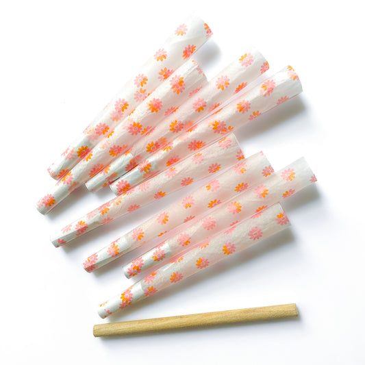 The Fleurt Cones, set of 8: pink and orange floral pre-rolled cones. These designer cones are girly, pretty, vegan, cute, cool, standard size, high quality, even burn, natural dyes, best tasting, slow burn.