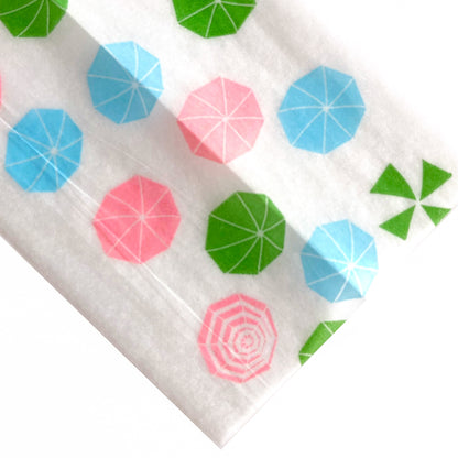 The Boardwalk Papers: beachy parasol, sun umbrella, umbrella printed rolling papers. These designer rolling papers are girly, pretty, vegan, cute, cool, standard size, high quality, even burn, natural dyes, best tasting, slow burn. 