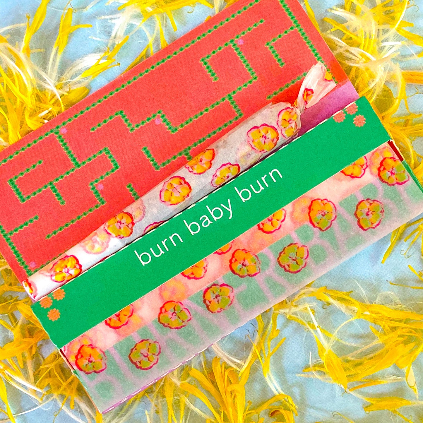 The Poppy Papers, set of 10: yellow poppy printed papers. These designer rolling papers are girly, pretty, vegan, cute, cool, standard size, high quality, even burn, natural dyes, best tasting, slow burn.