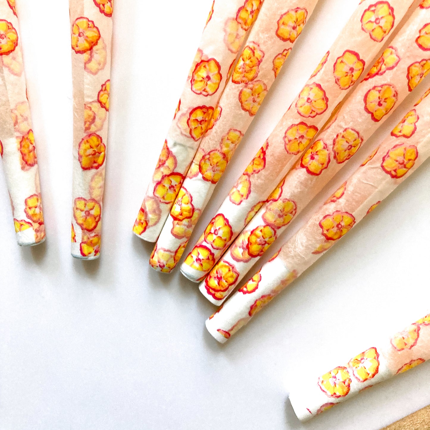 The Poppy Cones, set of 8 pre-rolled cones: yellow poppy printed cones. These designer pre-rolled cones are girly, pretty, vegan, cute, cool, standard size, high quality, even burn, natural dyes, best tasting, slow burn.