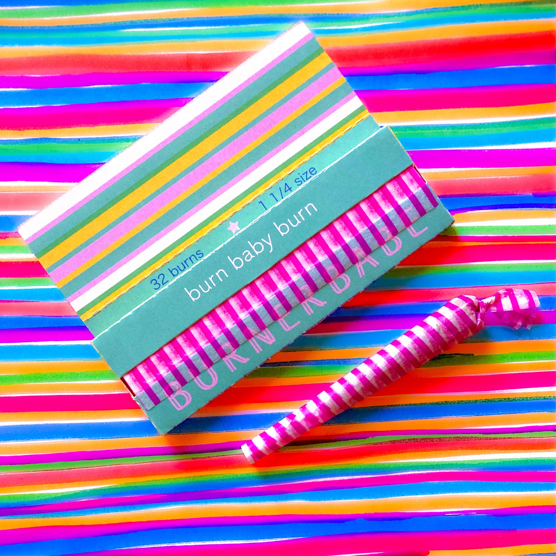 The Poseur Papers, set of 10: magenta striped rolling papers. These designer rolling papers are girly, pretty, vegan, cute, cool, standard size, high quality, even burn, natural dyes, best tasting, slow burn.