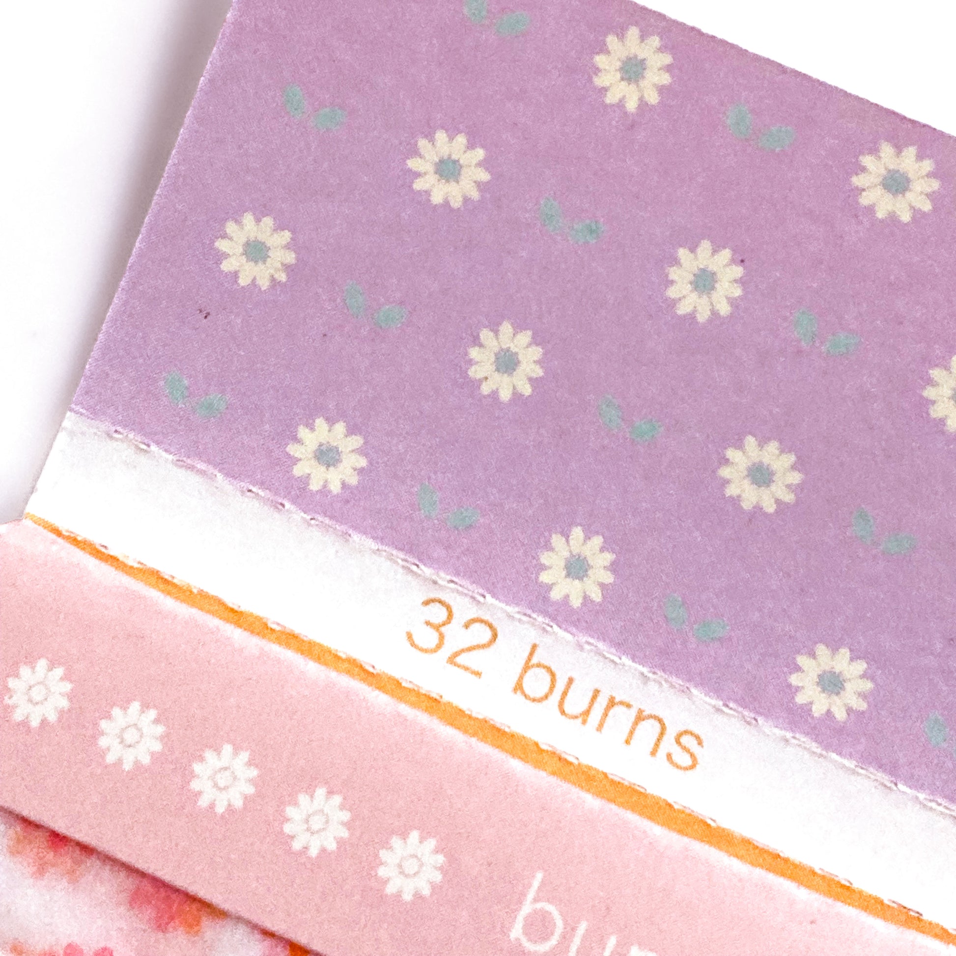 The Fleurt Papers: pink and orange floral rolling papers. These designer rolling papers are girly, pretty, vegan, cute, cool, standard size, high quality, even burn, natural dyes, best tasting, slow burn.