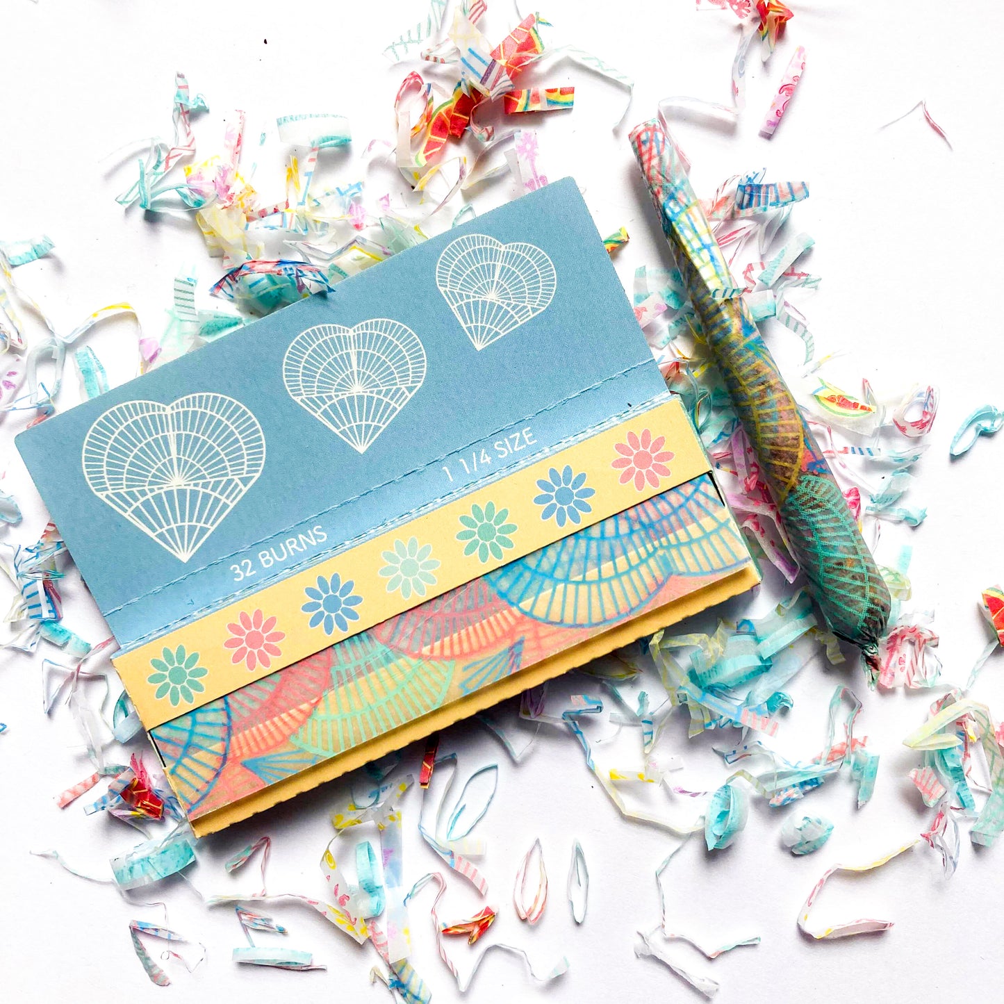 The Heartbreaker Papers: colorful spiral printed rolling papers. These designer rolling papers are girly, pretty, vegan, cute, cool, standard size, high quality, even burn, natural dyes, best tasting, slow burn.
