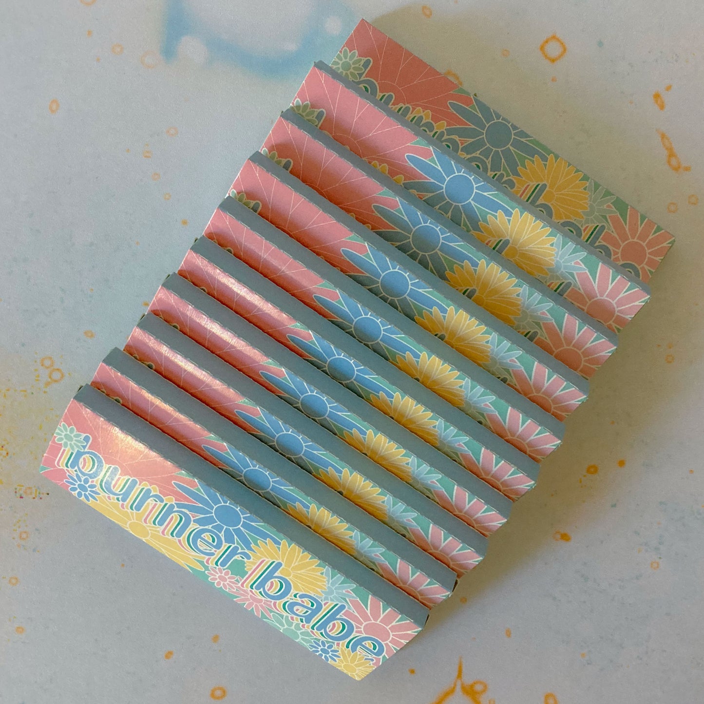 The Heartbreaker Papers, set of 10: spiral printed rolling papers. These designer rolling papers are girly, pretty, vegan, cute, cool, standard size, high quality, even burn, natural dyes, best tasting, slow burn. 